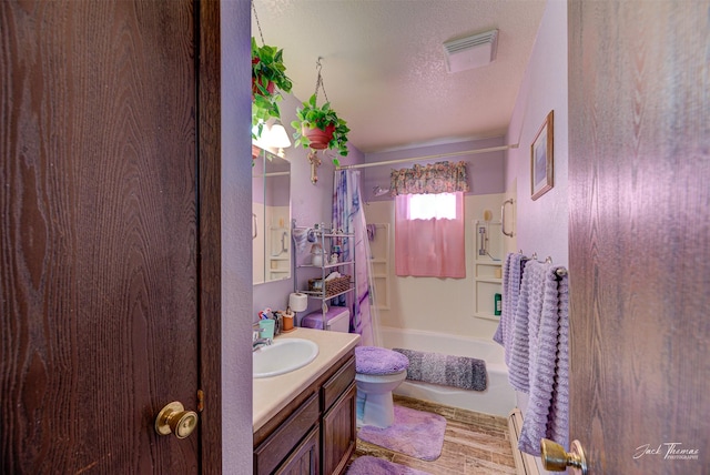 full bathroom with vanity, a textured ceiling, toilet, and shower / bathtub combination with curtain