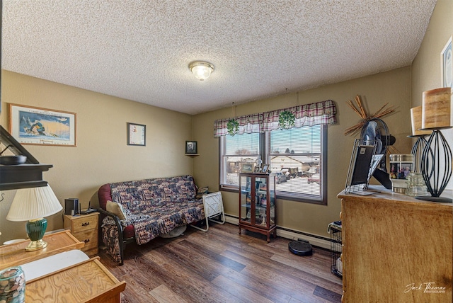 interior space with dark hardwood / wood-style flooring, a textured ceiling, and a baseboard heating unit