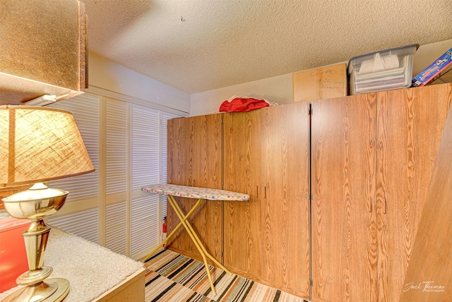 interior space featuring a textured ceiling