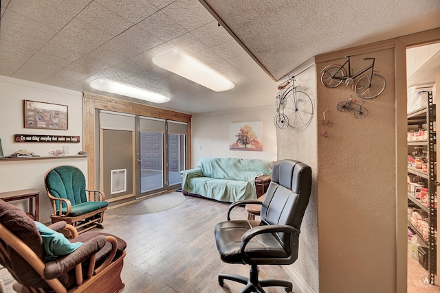 living room featuring crown molding and wood-type flooring