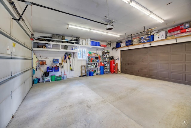 garage featuring a garage door opener