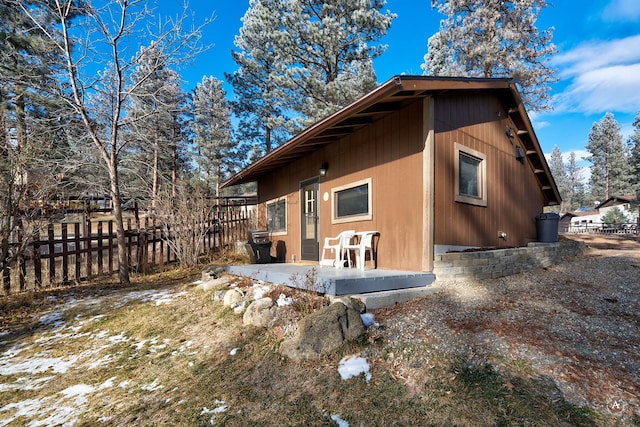 view of side of home featuring a patio