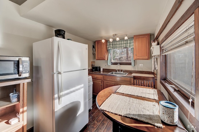 kitchen with white appliances and sink