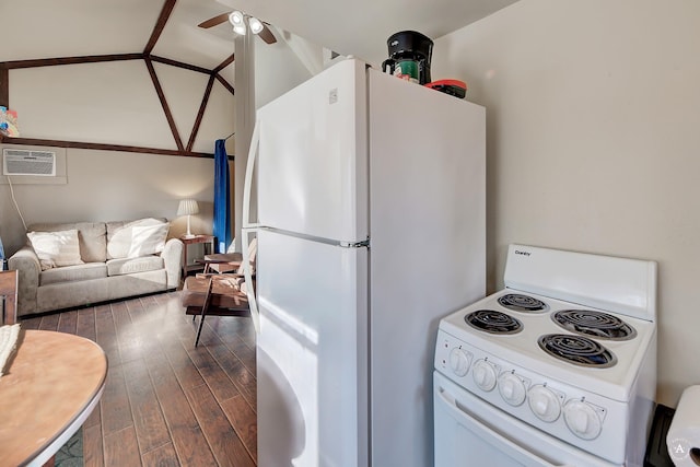 kitchen with lofted ceiling, white appliances, an AC wall unit, ceiling fan, and dark hardwood / wood-style flooring