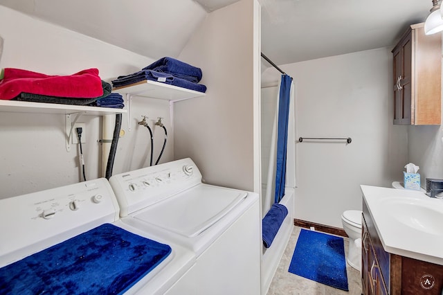 clothes washing area with washer and dryer and sink