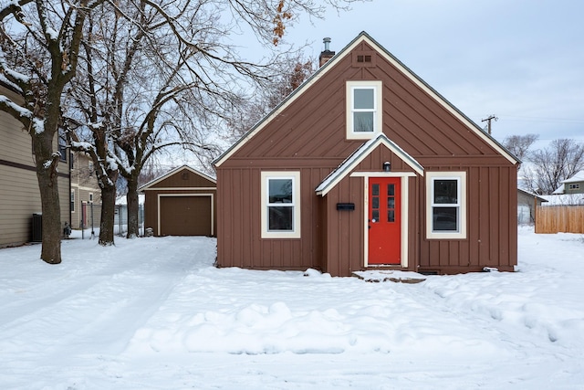 view of front facade with an outdoor structure and a garage