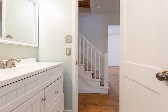 bathroom featuring vanity and hardwood / wood-style flooring