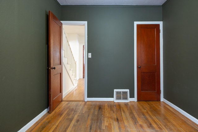 empty room featuring dark hardwood / wood-style flooring