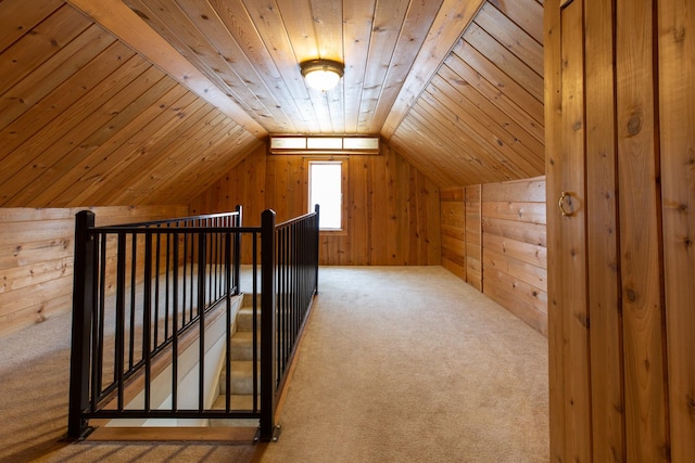 additional living space featuring carpet, wooden ceiling, and vaulted ceiling