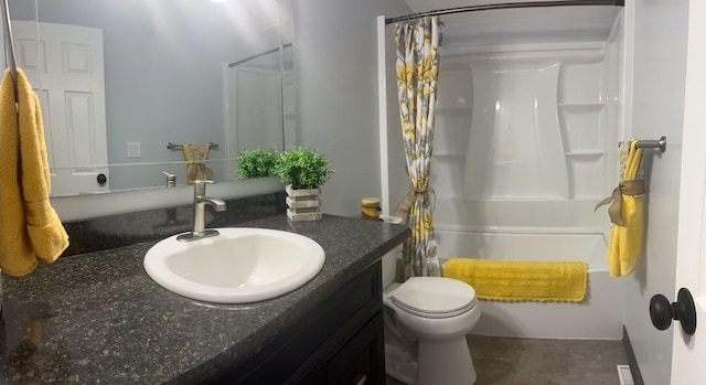 full bathroom featuring shower / bath combo, vanity, and toilet