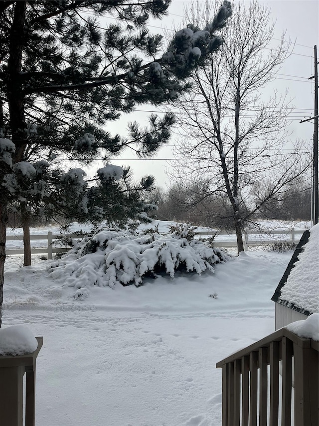 view of yard layered in snow