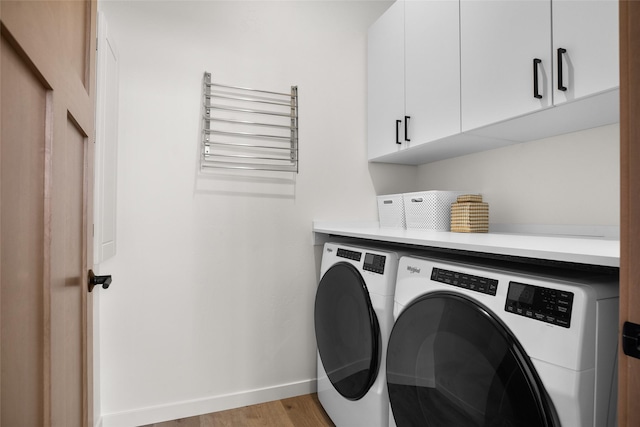 124 W 2nd St Unit B, Whitefish, MT 59937 - laundry area with washing machine and clothes dryer, cabinet space, baseboards, and light wood finished floors