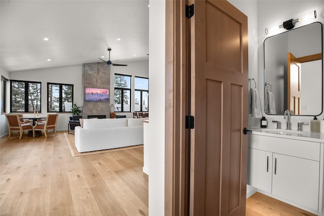 124 W 2nd St Unit B, Whitefish, MT 59937 - full bathroom with vaulted ceiling, wood finished floors, recessed lighting, vanity, and a ceiling fan