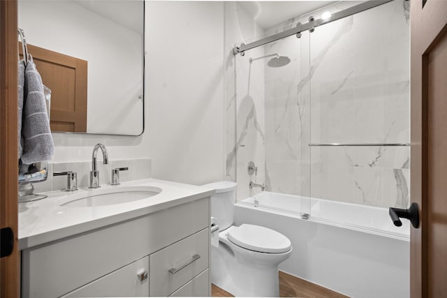 124 W 2nd St Unit B, Whitefish, MT 59937 - bathroom with vanity, toilet, shower / bath combination with glass door, and wood finished floors