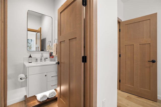 124 W 2nd St Unit B, Whitefish, MT 59937 - bathroom with wood finished floors and vanity