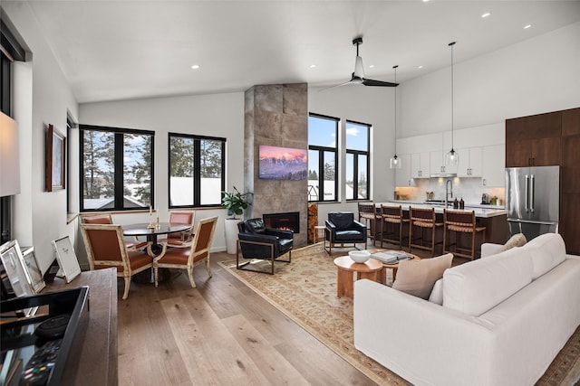 124 W 2nd St Unit B, Whitefish, MT 59937 - living area featuring high vaulted ceiling, light wood finished floors, recessed lighting, and baseboards