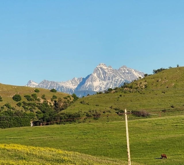 mountain view featuring a rural view