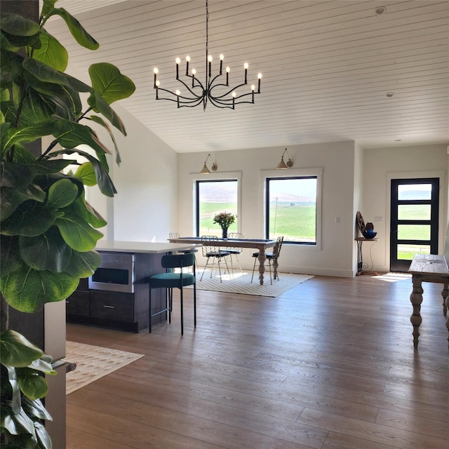 dining area featuring wooden ceiling and dark wood-type flooring