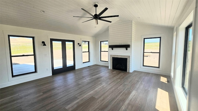 unfurnished living room with wooden ceiling, a large fireplace, dark wood-type flooring, vaulted ceiling, and french doors