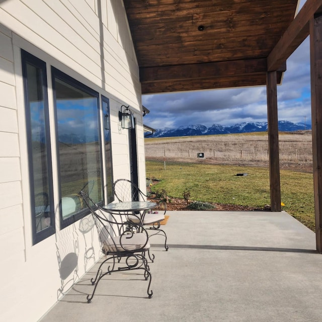 view of patio / terrace featuring a mountain view