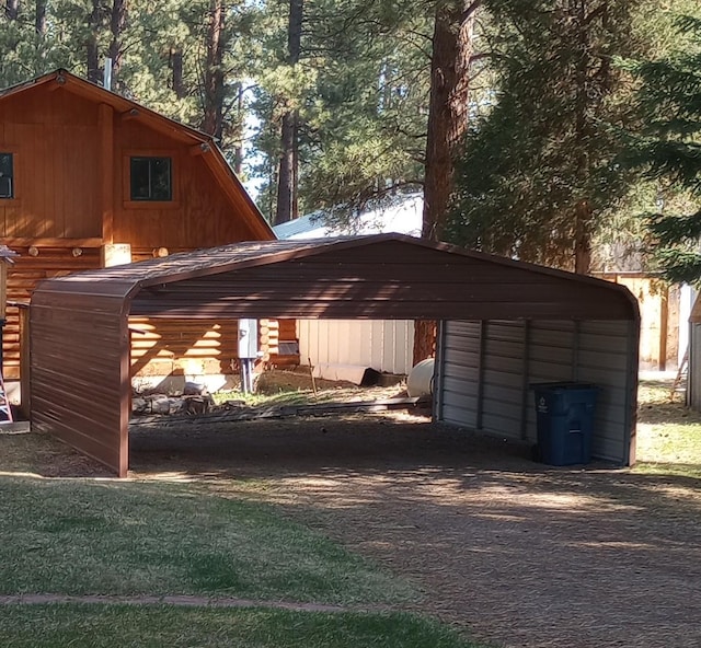 920 N 3rd St, Lincoln, MT 59639 - view of parking featuring a carport and driveway