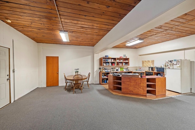 kitchen with carpet flooring, white refrigerator, wooden ceiling, and kitchen peninsula