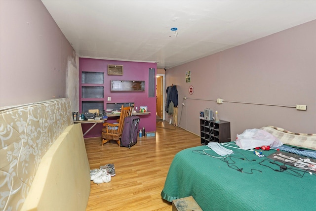 bedroom featuring wood-type flooring