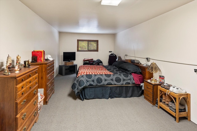 bedroom featuring light colored carpet