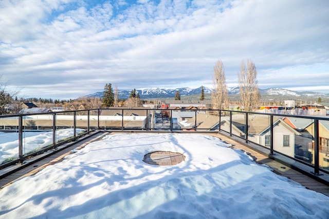 view of patio / terrace with a balcony and a mountain view