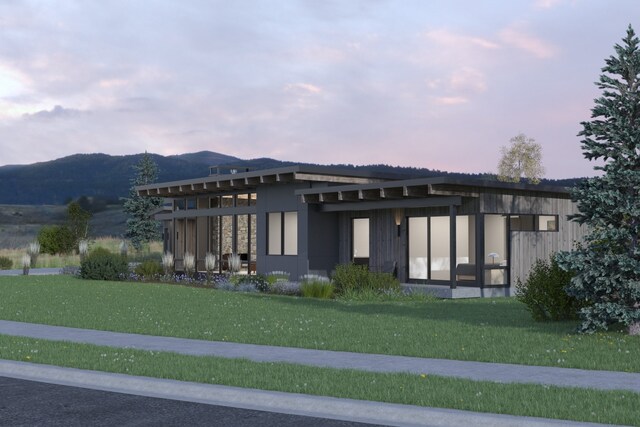 10580 Royal Coachman Dr, Missoula, MT 59808 - view of front of home with a lawn and a mountain view