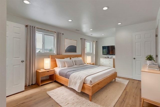 bedroom with light hardwood / wood-style floors