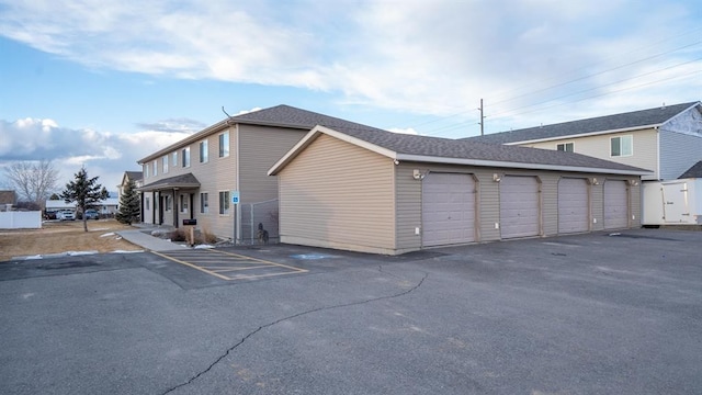 view of property exterior with a garage