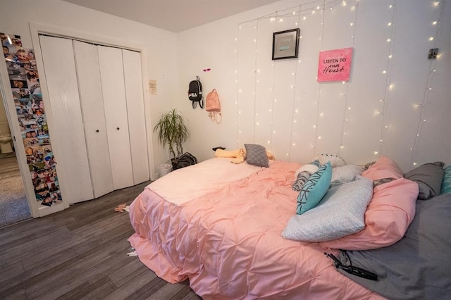 bedroom featuring a closet and dark hardwood / wood-style flooring