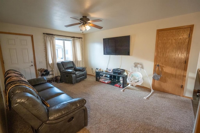 living room with carpet flooring and ceiling fan