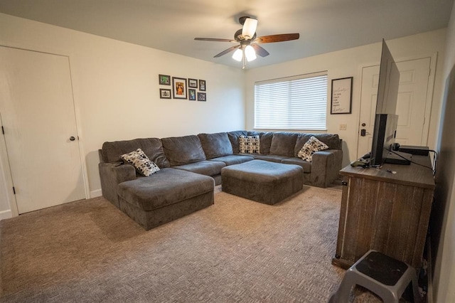 carpeted living room featuring ceiling fan