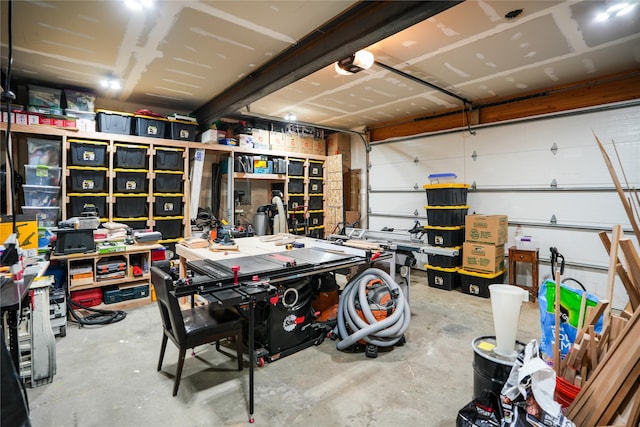 garage with a workshop area and a garage door opener