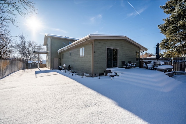 view of snow covered house