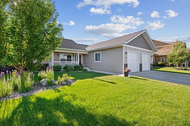 ranch-style home with a porch, a front yard, driveway, and an attached garage