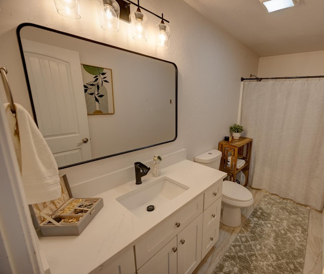 full bathroom with curtained shower, vanity, toilet, and wood finished floors