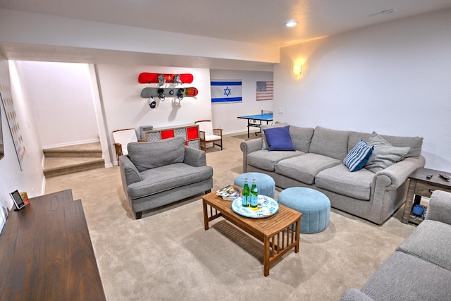 living room with recessed lighting, light carpet, and baseboards