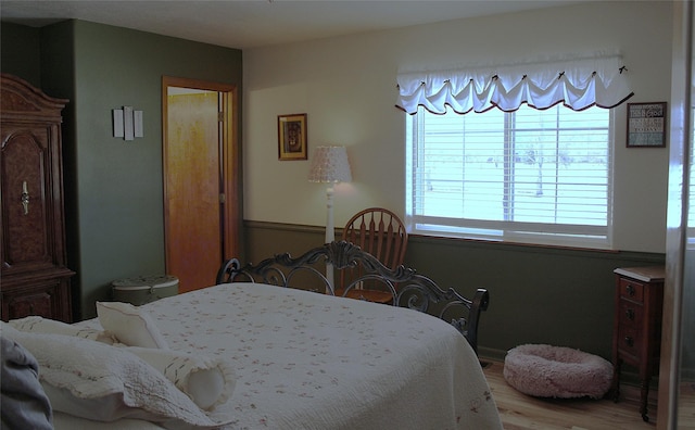 bedroom with light wood-type flooring