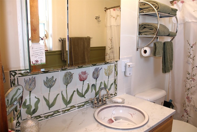 bathroom with vanity and toilet