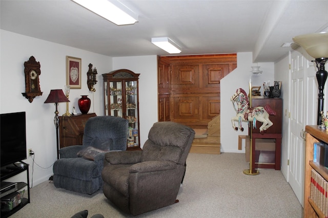 living area featuring light colored carpet