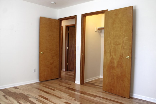 15 Sully Rd, Plains, MT 59859 - unfurnished bedroom with light wood finished floors, a closet, and baseboards