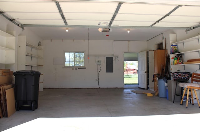 15 Sully Rd, Plains, MT 59859 - garage featuring electric panel and a garage door opener