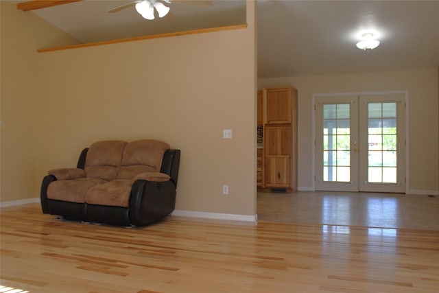15 Sully Rd, Plains, MT 59859 - living area featuring lofted ceiling, a ceiling fan, baseboards, light wood-style flooring, and french doors