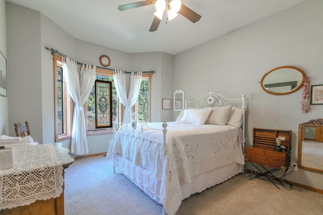 bedroom featuring ceiling fan and light colored carpet