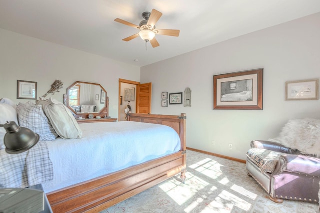 bedroom featuring ceiling fan and light carpet