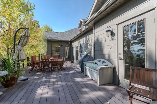 wooden terrace with a grill