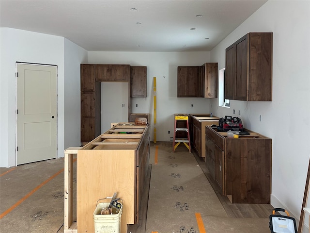 kitchen with dark brown cabinetry